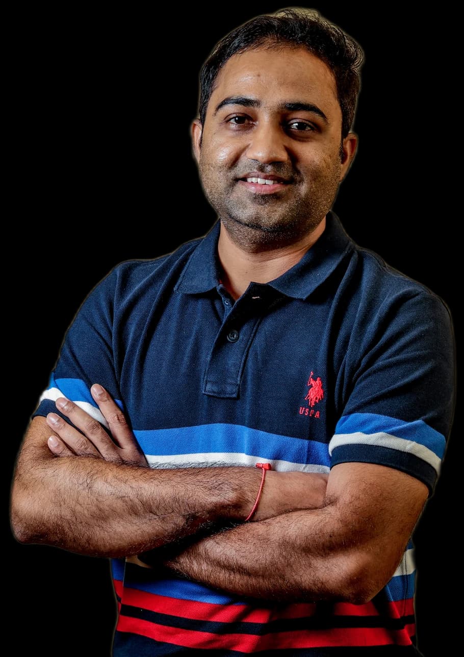 KinjalKumar Patel, arms crossed, studio portrait